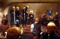 Still from the Mos Eisley Cantina scene in Star Wars showing the alien band performing, used for the May the Forth Be With You event promotion