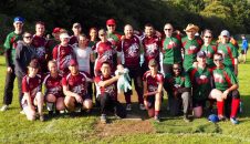 Joint group photo of Dales players in green kit and Bobcats players in maroon posing together on the field at the NW Series in 2018, warm evening light