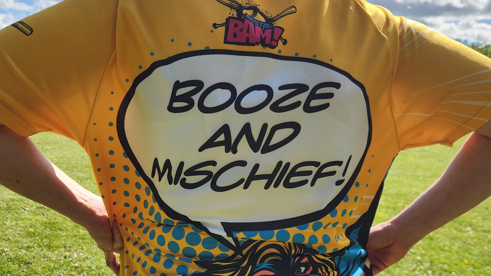 Close-up of a BAM team jersey featuring Booze and Mischief text in comic book speech bubble style