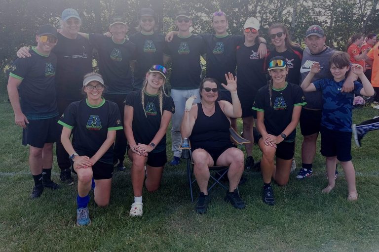 Hackers softball team group photo in dark kit