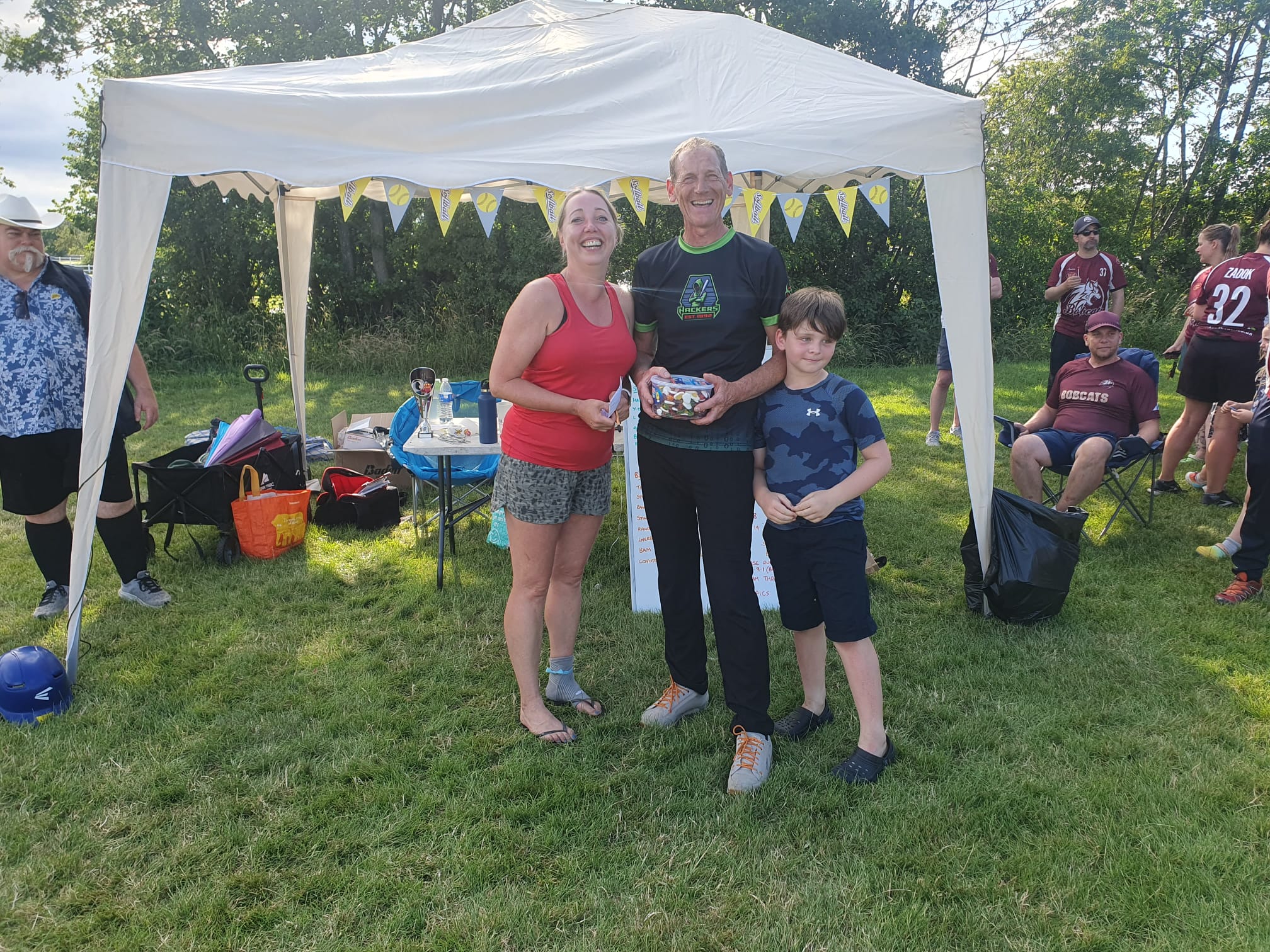 Hackers Runners Up Hackers team representatives collecting runners-up prize under a marquee at the Leeds tournament ceremony
