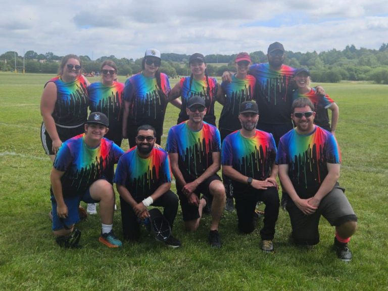 Splash softball team in rainbow kit group photo