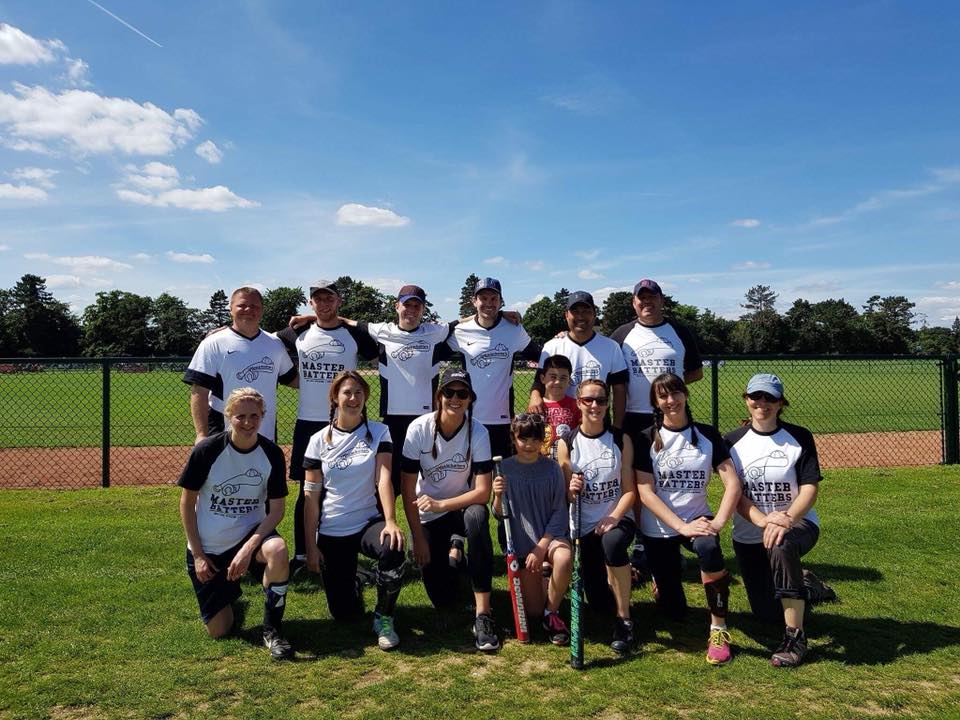 Masterbatters softball team group photo in white and black kit